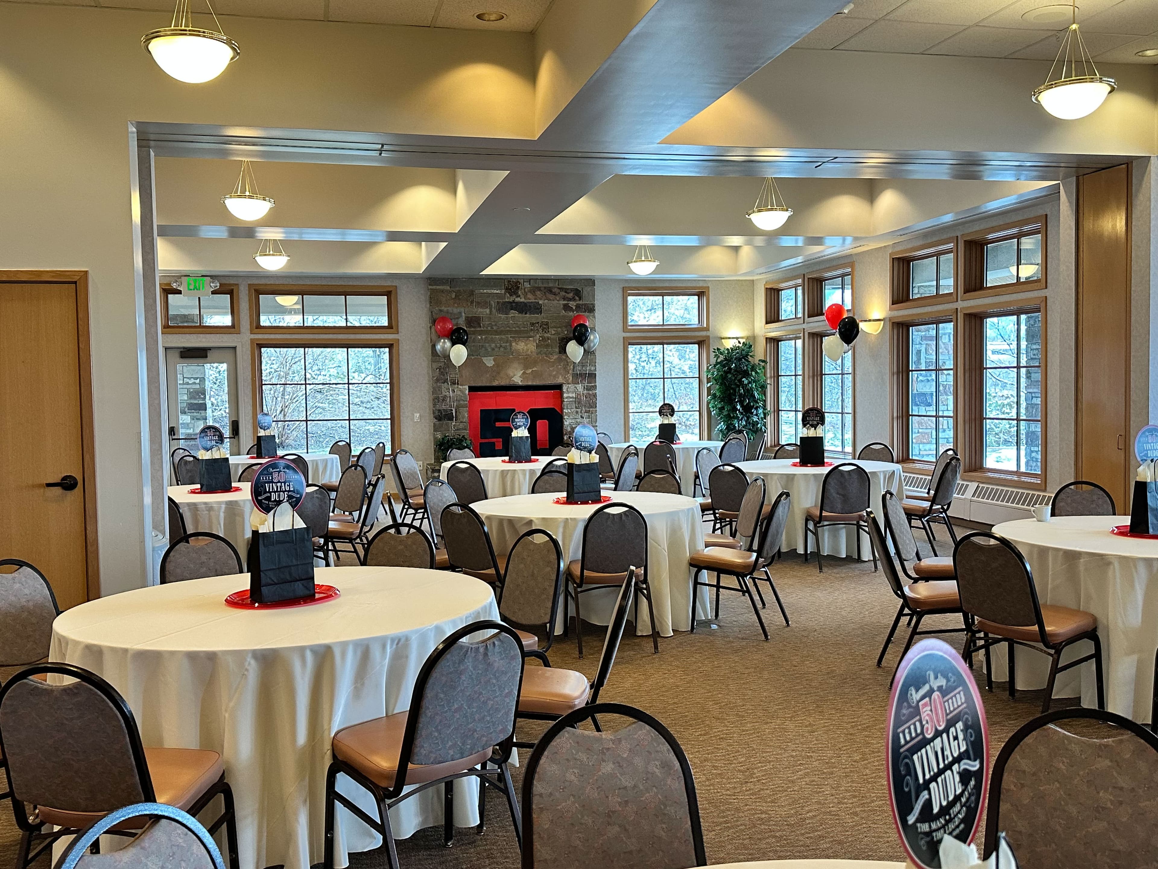 Birthday celebration with guests gathered at Old Mill Banquet Hall outdoor patio
