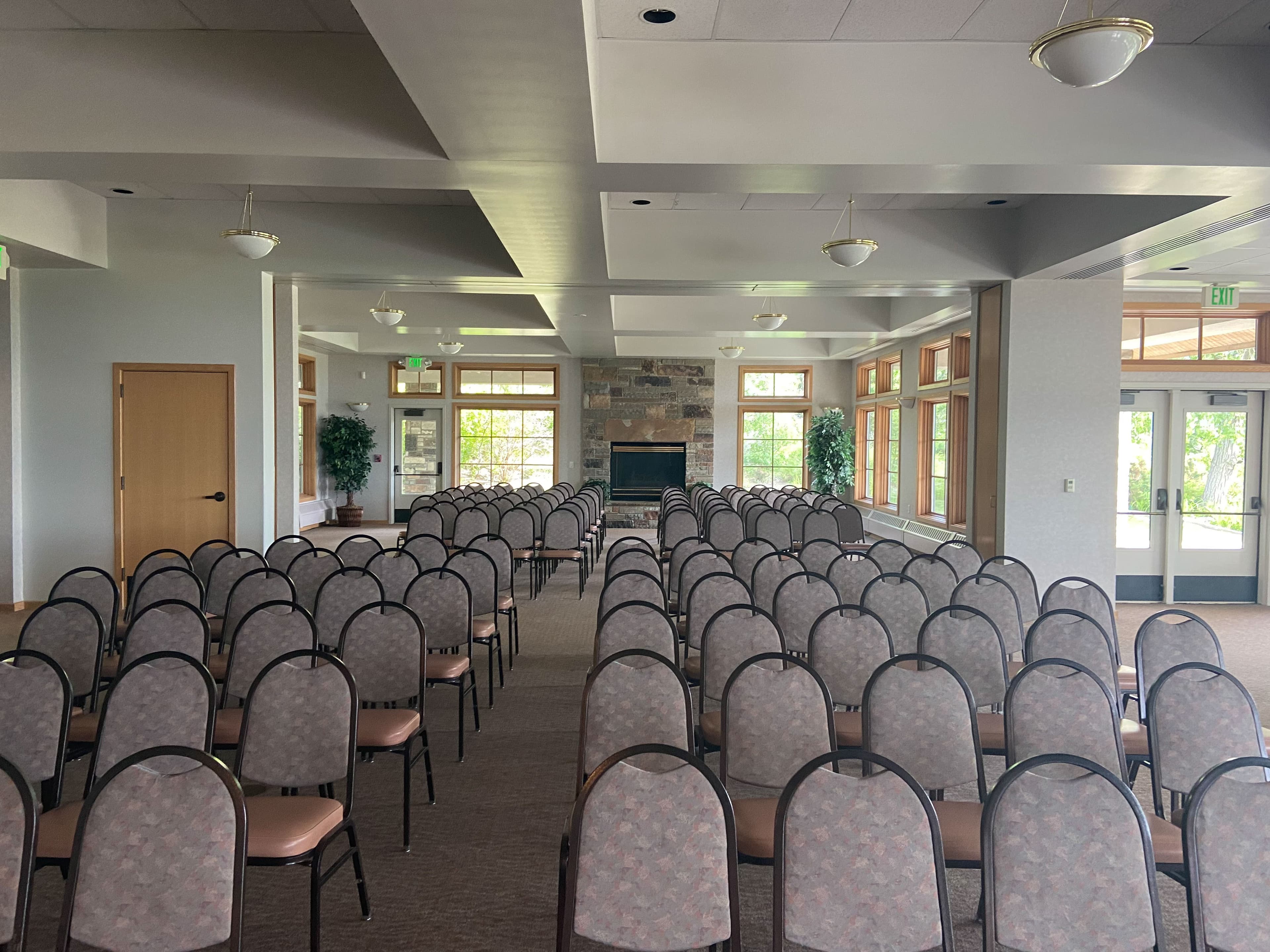Old Mill Banquet Hall interior set up with tables chairs and AV equipment for an event